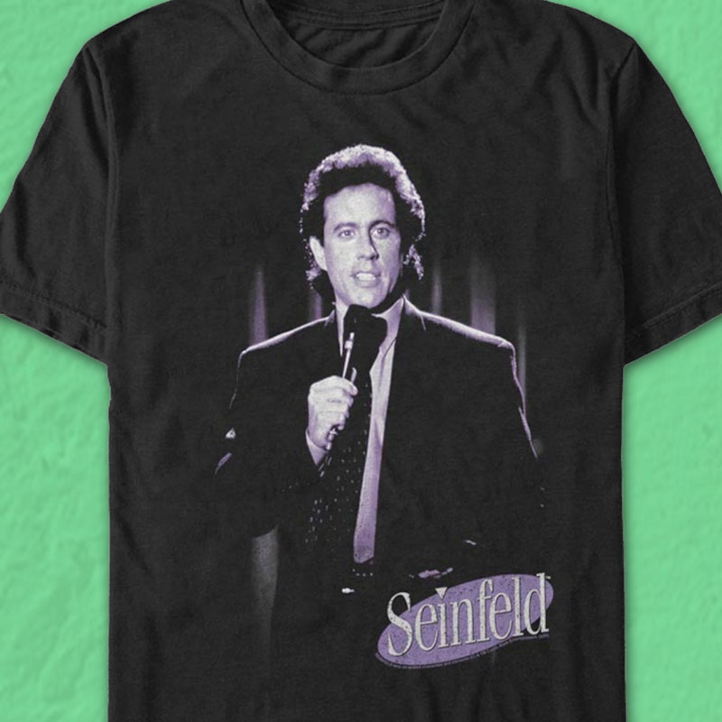 https://80steess3.imgix.net/production/products/SEIN146/stand-up-comedy-seinfeld-t-shirt.multi.jpeg?w=800&h=800&fit=max&usm=12
